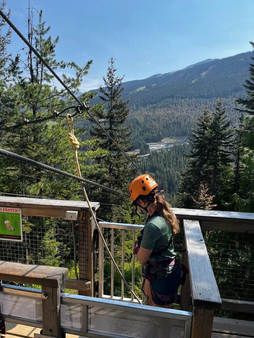 A rider waiting at the rail above the valley