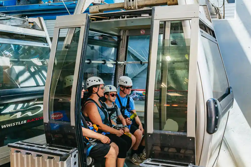 Riders in the gondola cabin on the way up