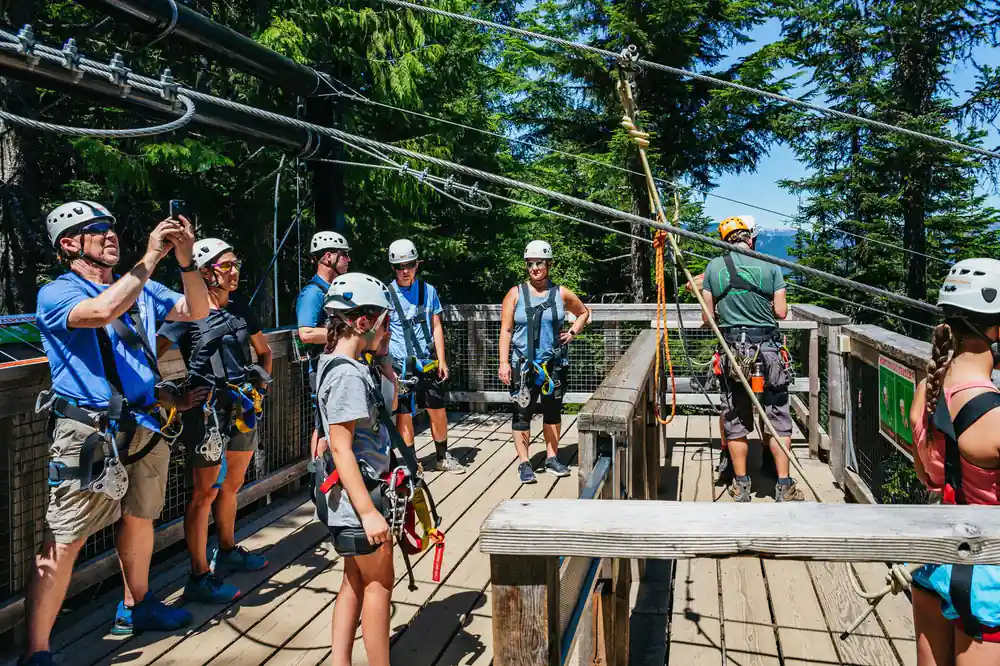 Riders waiting on a timber deck in the forest